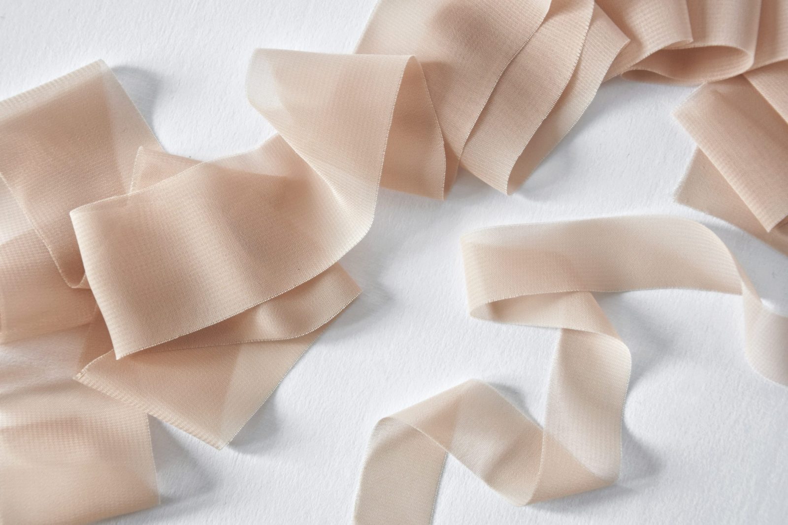 Chiffon ribbon with delicately frayed edges in nude - Mayflower